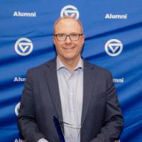 Peter Riemersma smiles holding his award